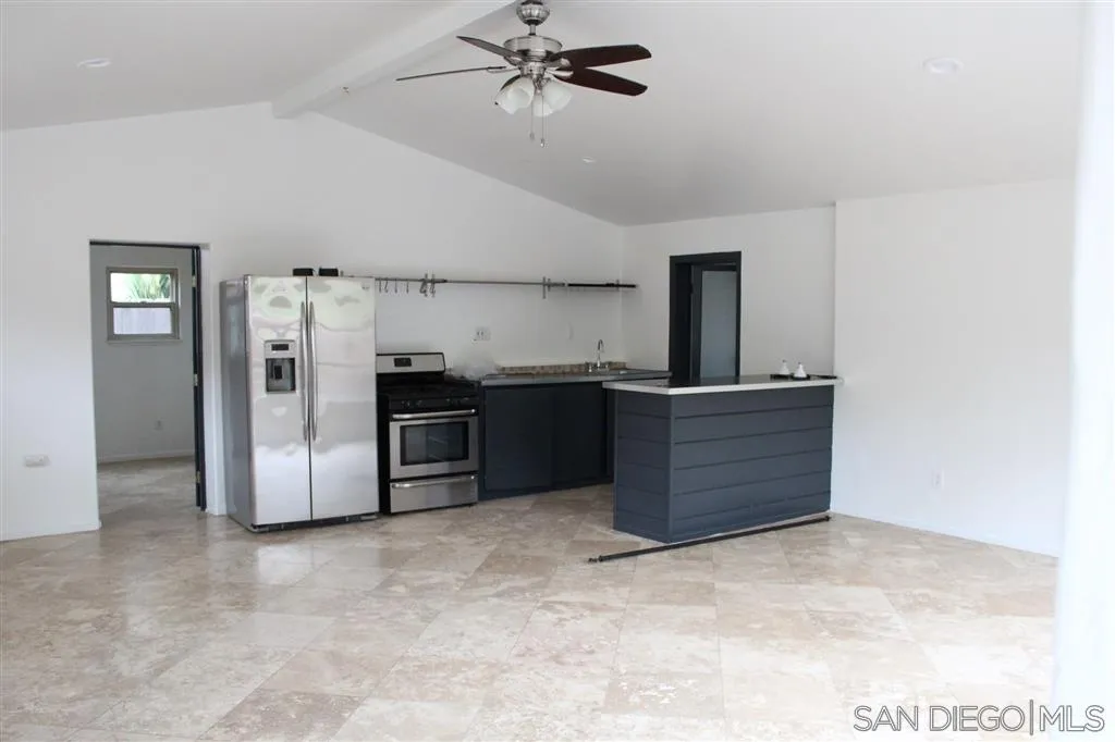 856 Capri Road Encinitas, CA 92024 - Photo 25 of 25 a kitchen with stainless steel appliances a refrigerator and cabinets