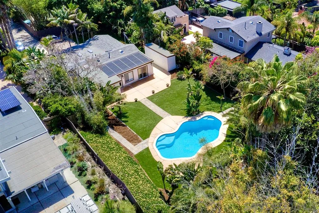 856 Capri Road Encinitas, CA 92024 - Photo 3 of 25 a view of a house with a yard and garden