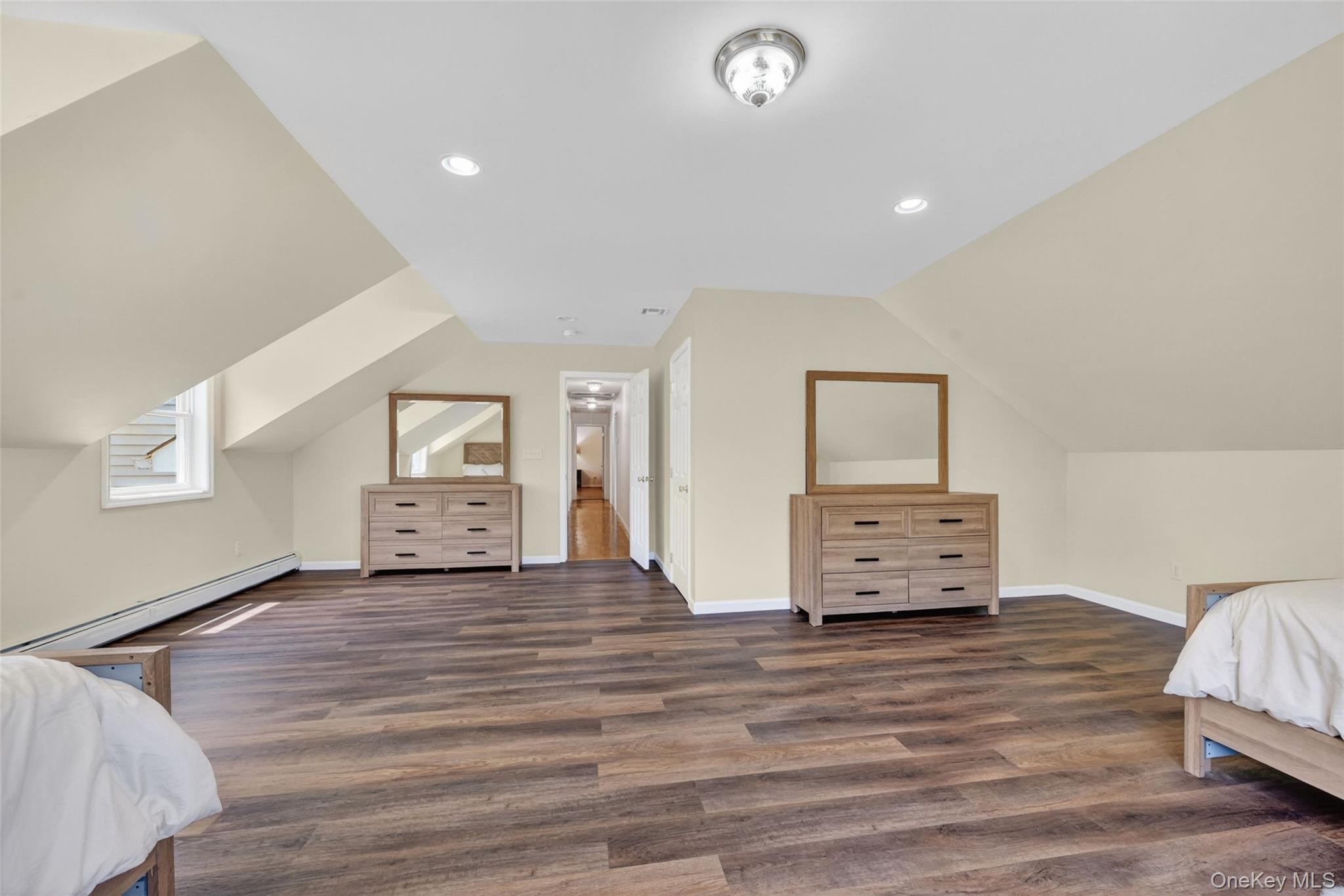 19 Bull Mine Road Chester, NY 10918 - Photo 33 of 42 Spacious room featuring sloped ceilings, recessed lighting, wood-finish flooring, and light-colored wall paint