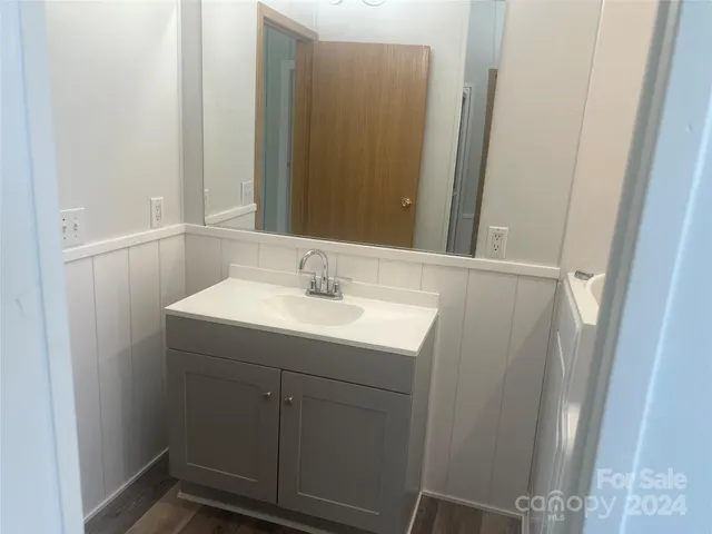 a bathroom with a sink and mirror