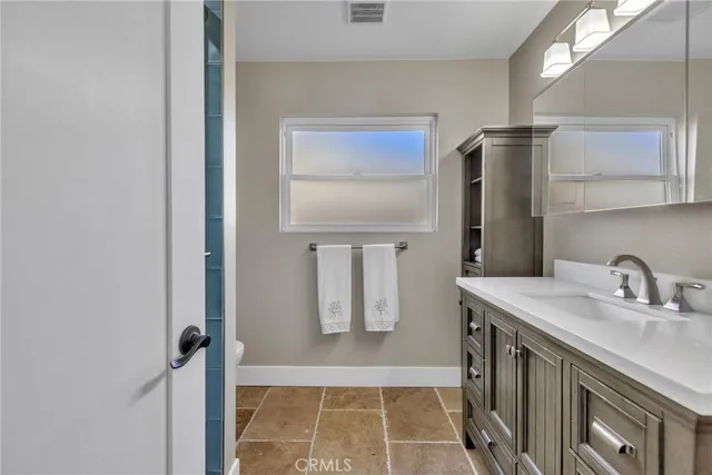 a en suite bathroom with a sink and a shower