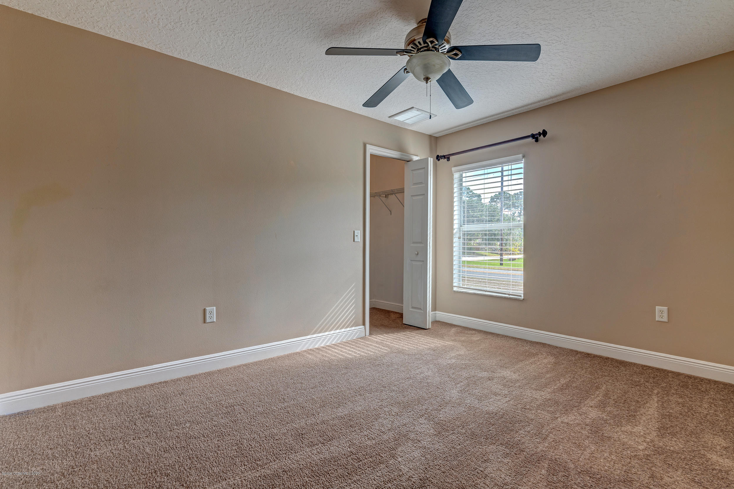 1306 Scranton Street Southwest Palm Bay, FL 32908 - Photo 12 of 36 a view of an empty room with a window