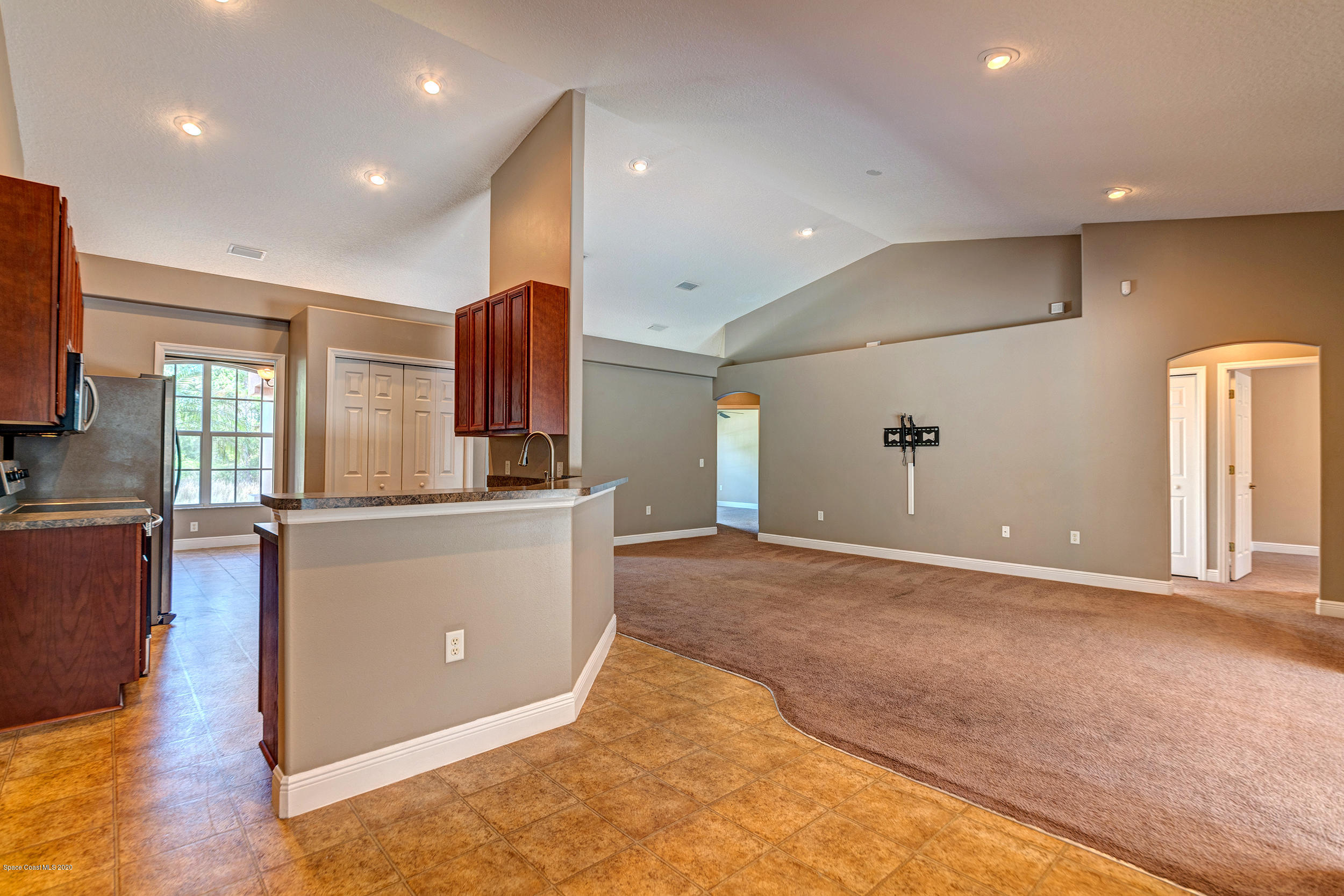 1306 Scranton Street Southwest Palm Bay, FL 32908 - Photo 21 of 36 a living room with stainless steel appliances furniture a kitchen view and a window