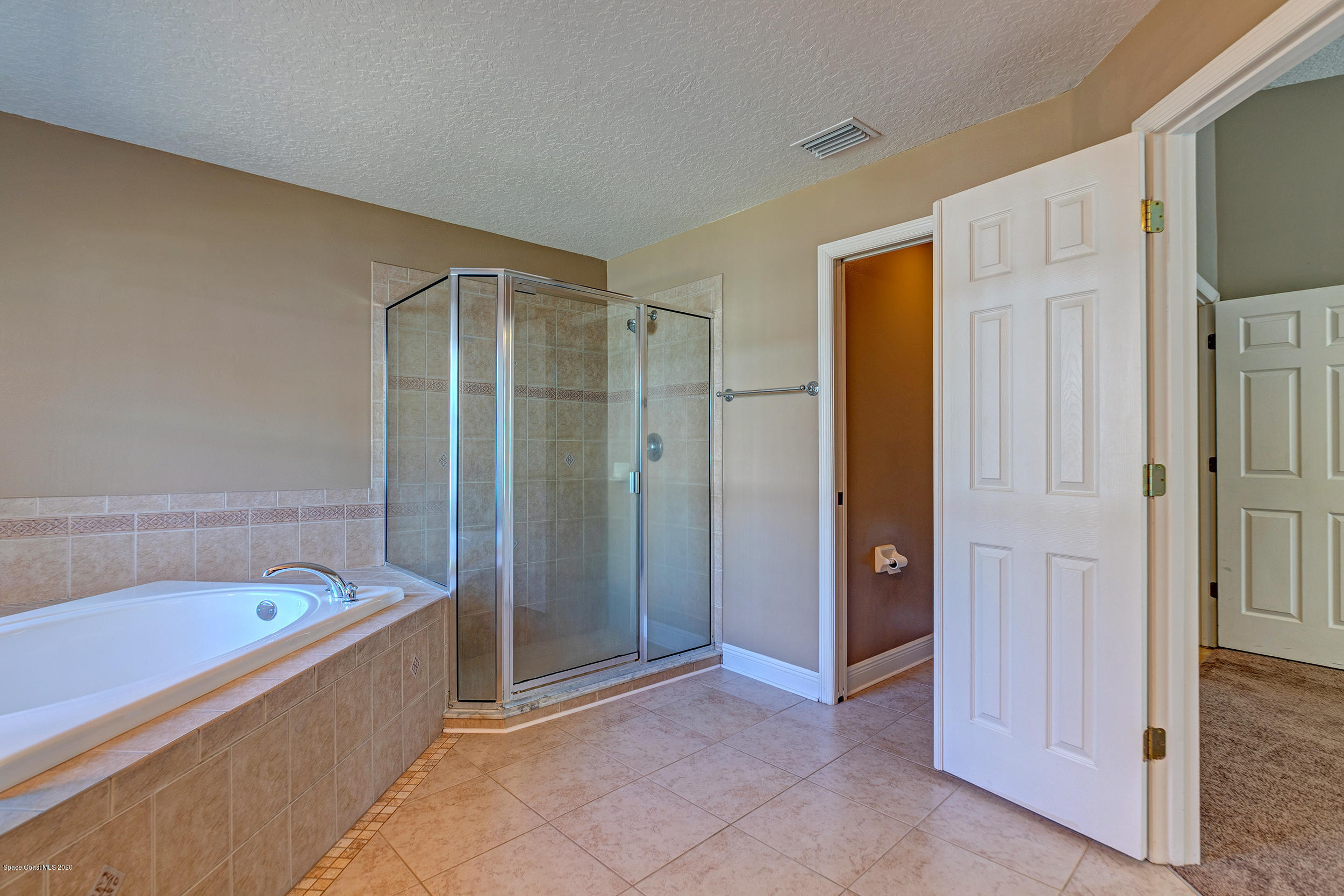 1306 Scranton Street Southwest Palm Bay, FL 32908 - Photo 30 of 36 a bathroom with a tub shower and sink