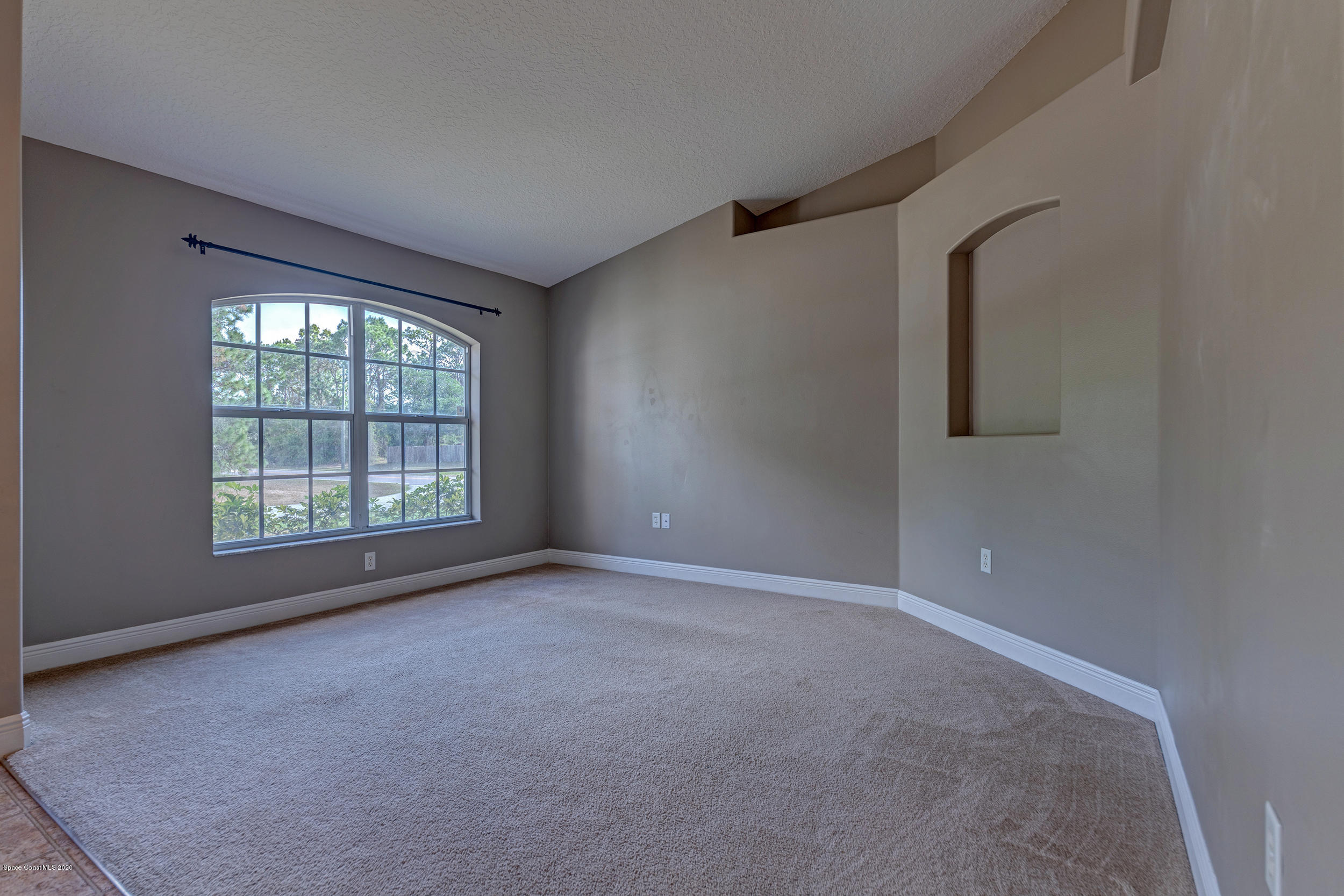 1306 Scranton Street Southwest Palm Bay, FL 32908 - Photo 7 of 36 a view of an empty room with a window