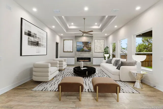 a living room with furniture and a large window