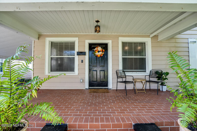 5116 Sunderland Road Jacksonville, FL 32210 - Photo 5 of 33 a view of a building with a porch
