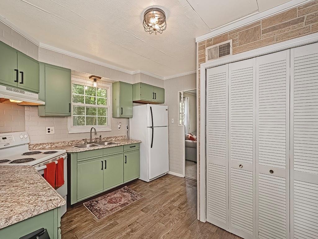 60 Neville Road Beaver, PA 15009 - Photo 15 of 23 a kitchen with a sink refrigerator and a window