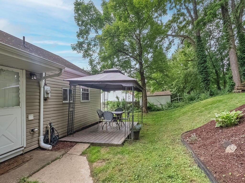 60 Neville Road Beaver, PA 15009 - Photo 4 of 23 a front view of a house with a yard table and chairs