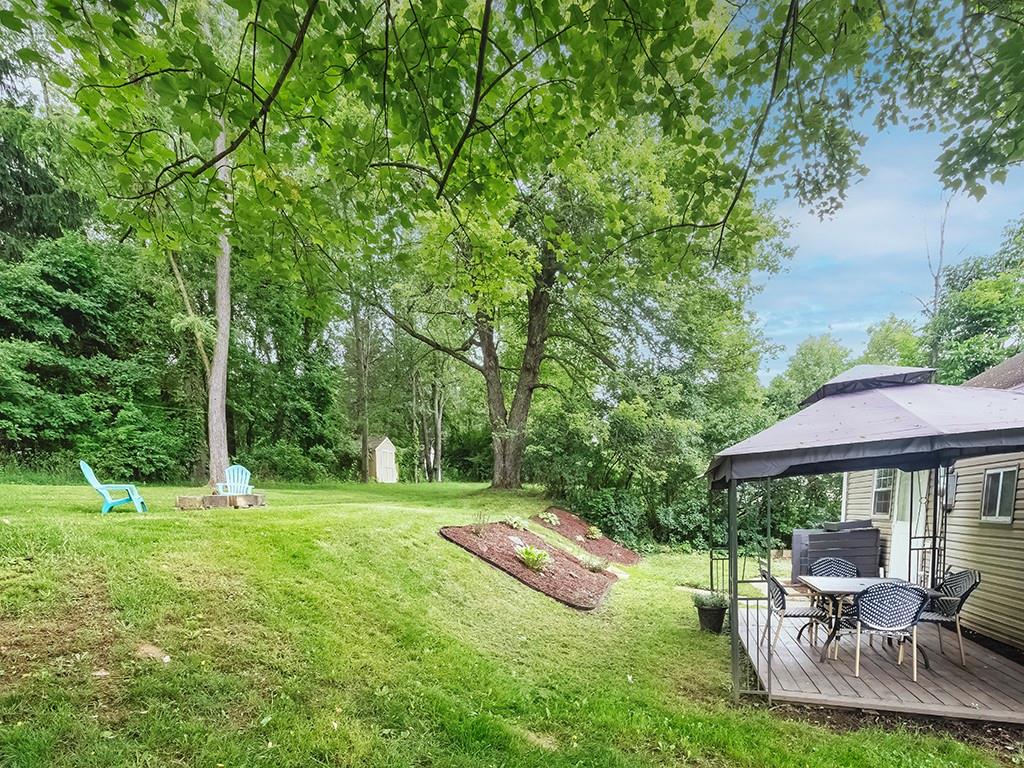 60 Neville Road Beaver, PA 15009 - Photo 8 of 23 a view of a table and chairs under an umbrella