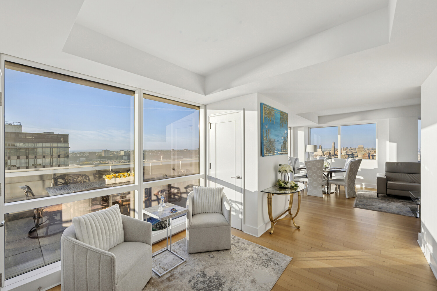 2628 Broadway, Unit 34 Manhattan, NY 10025 - Photo 2 of 9 a living room with furniture large window and a table