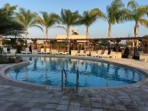 a view of swimming pool with outdoor seating