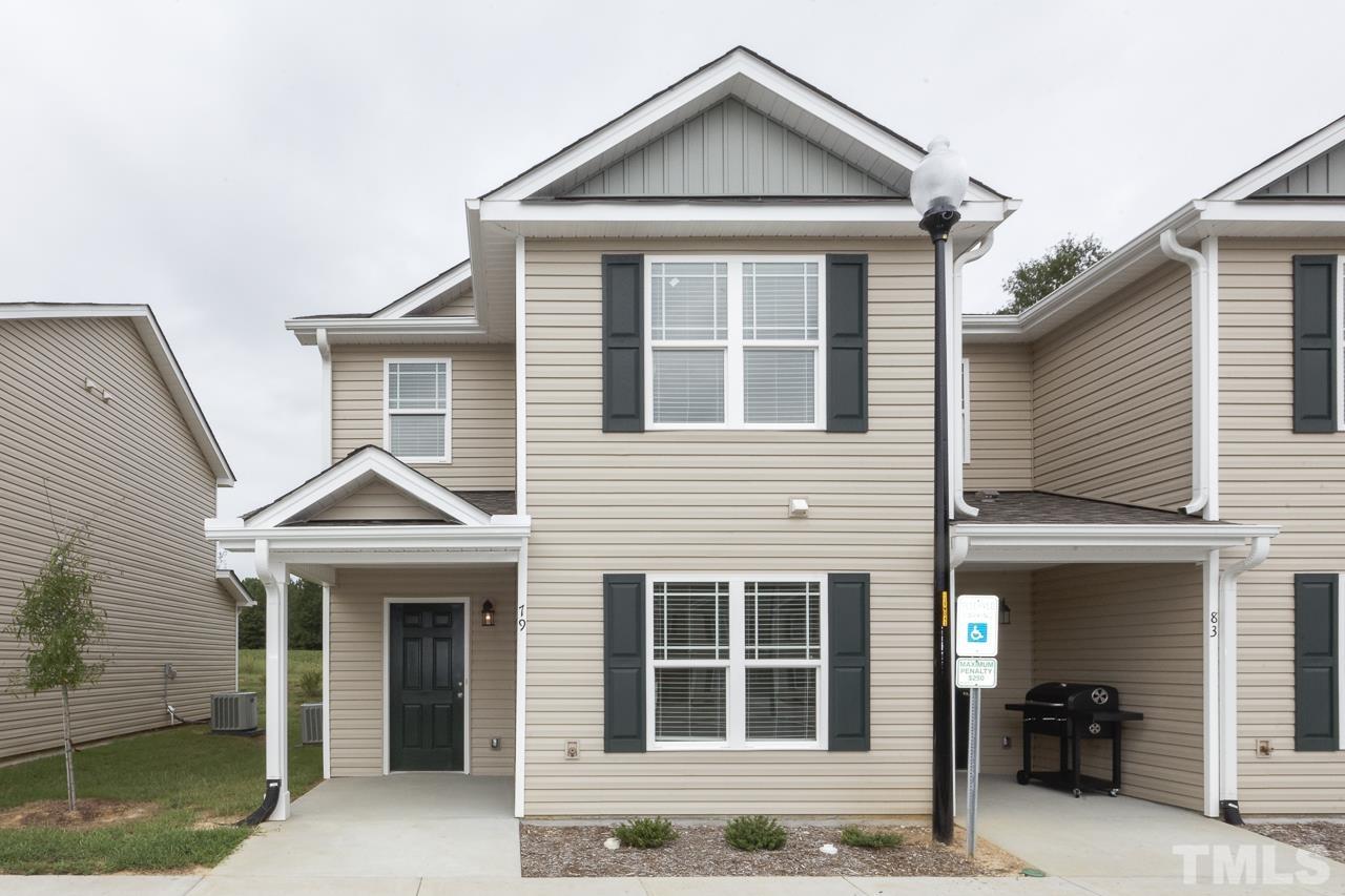 50 River Stancil Drive Lillington, NC 27546 - Photo 1 of 22 a front view of a house with a yard
