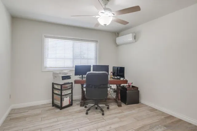 a bedroom with bed and a chandelier