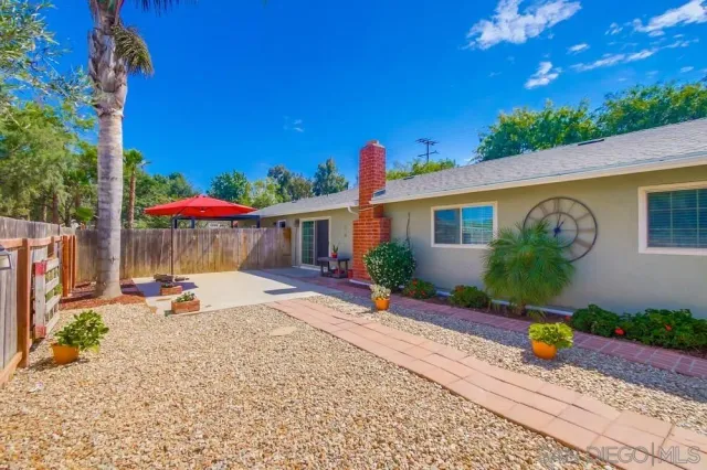 an empty room with closet and windows