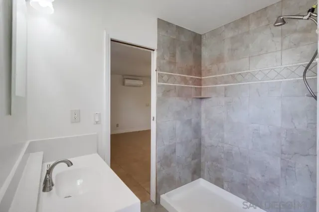 a view of a street with a large tree