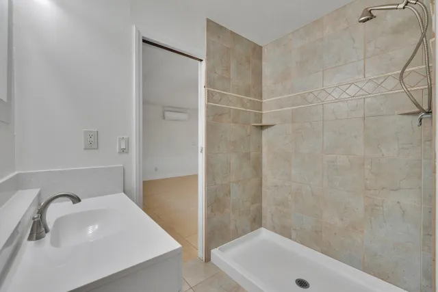 an aerial view of a house with a ocean view