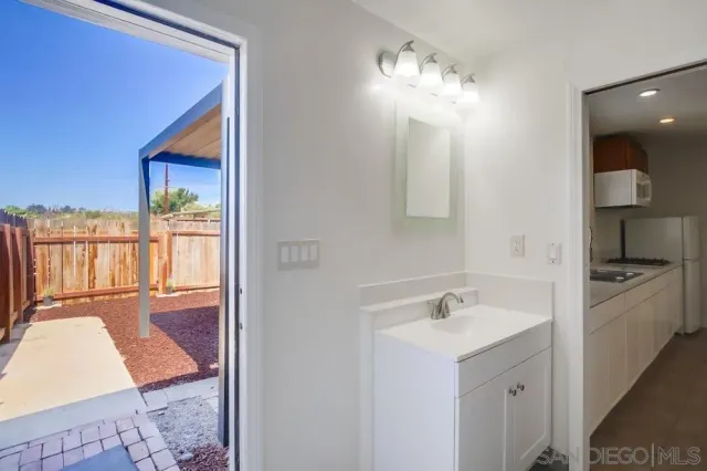 an aerial view of a house with a lake view
