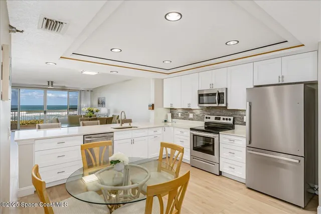 a kitchen with a sink appliances and a counter top space