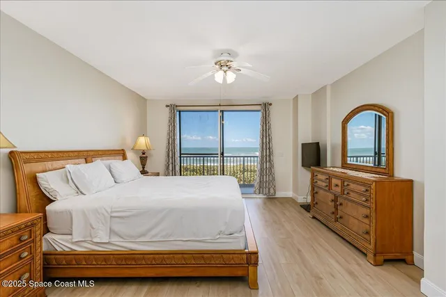 a bedroom with a bed and a mirror