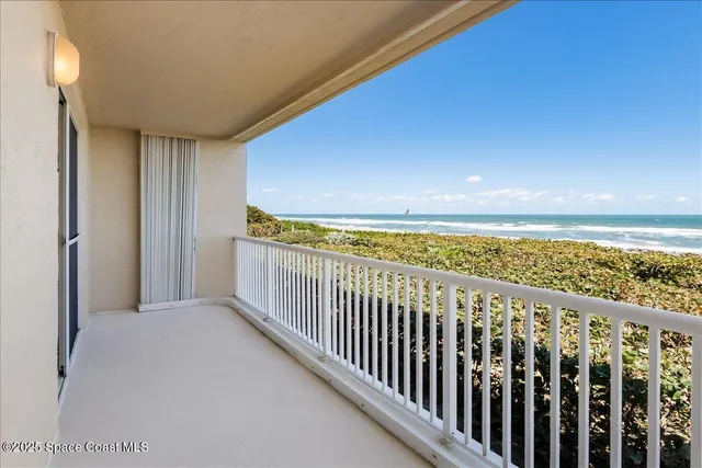 a view of a swimming pool with a lounge chair