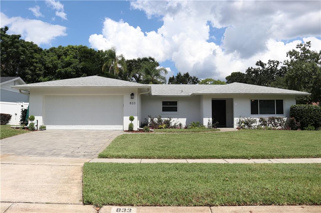 833 Woodside Road Maitland, FL 32751 - Photo 1 of 1 a front view of a house with a garden