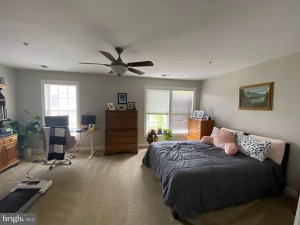 a bedroom with a bed and furniture