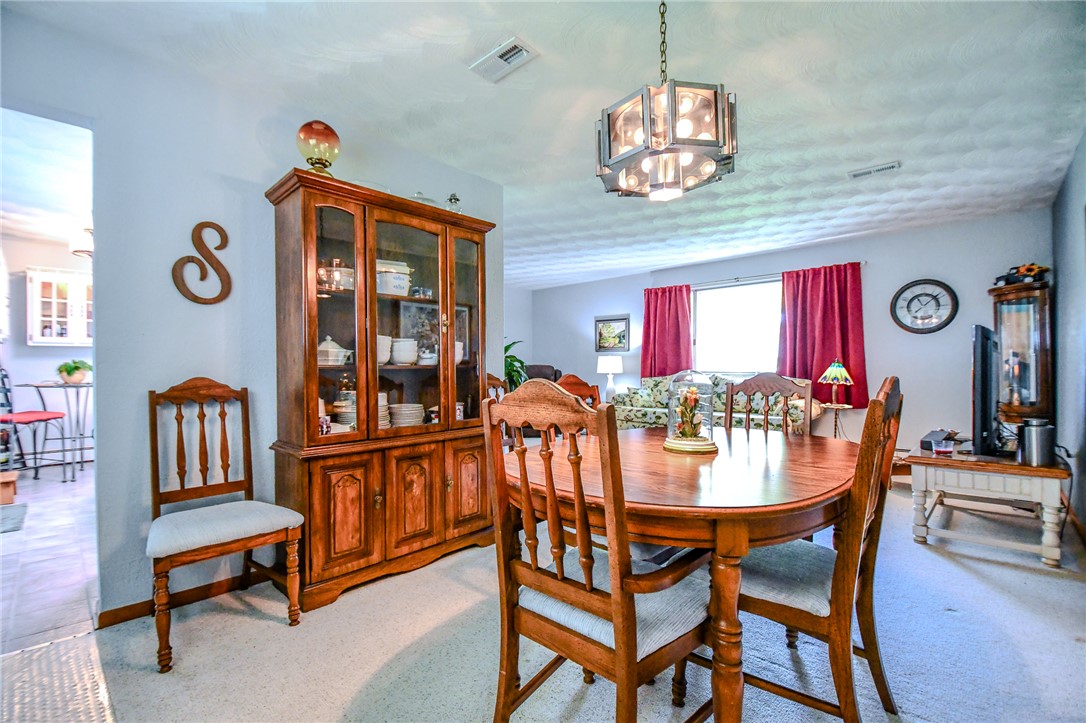 10833 Kendig Road Medway, OH 45341 - Photo 15 of 46 This inviting dining area features a warm ambiance, perfect for intimate gatherings and memorable meals.