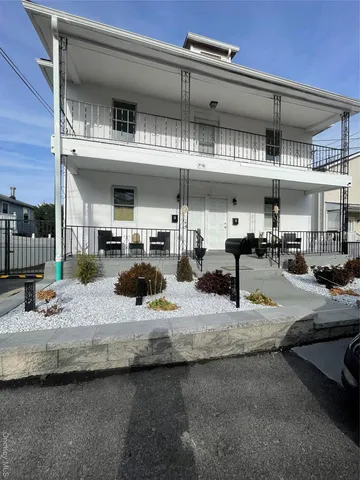 a kitchen with cabinets and white stainless steel appliances