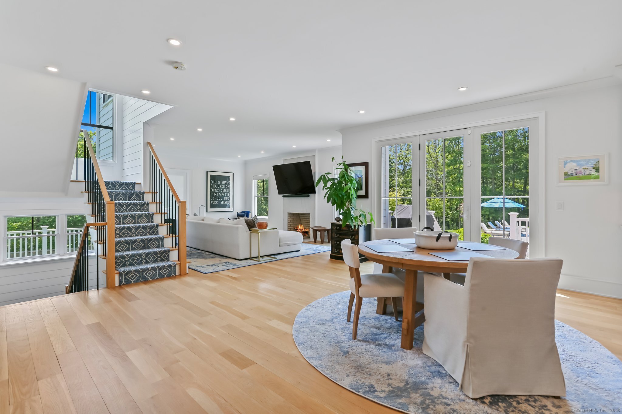 2015 Redding Road Fairfield, CT 06824 - Photo 13 of 40 a living room with furniture a large window and wooden floor