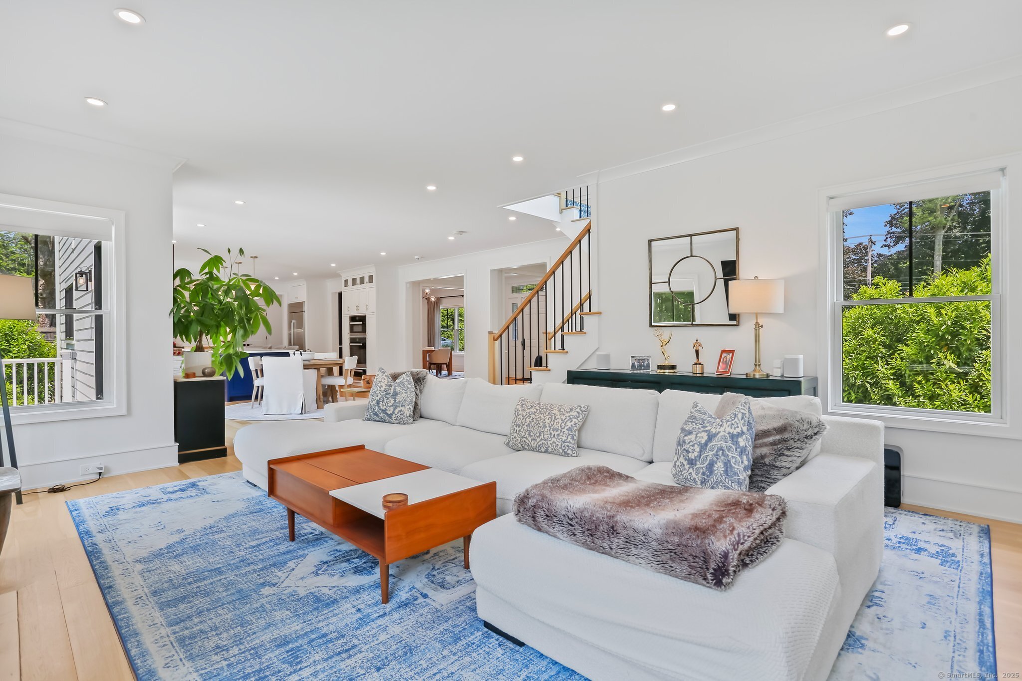 2015 Redding Road Fairfield, CT 06824 - Photo 15 of 40 a living room with furniture and a potted plant