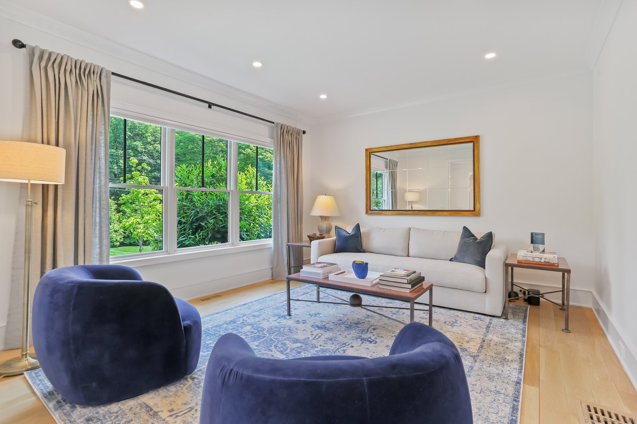 2015 Redding Road Fairfield, CT 06824 - Photo 17 of 40 a living room with furniture and a large window