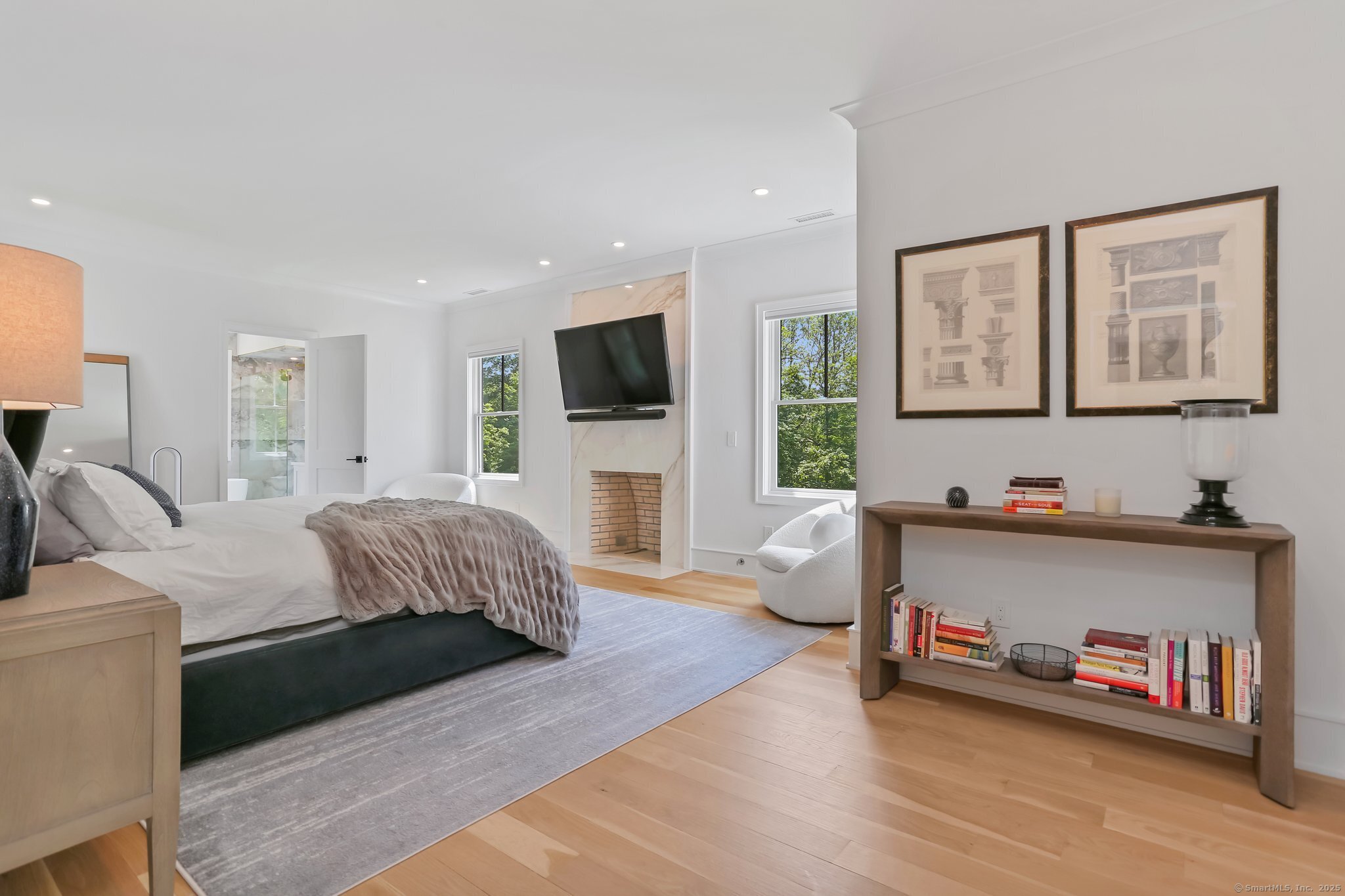 2015 Redding Road Fairfield, CT 06824 - Photo 20 of 40 a living room with furniture and a flat screen tv