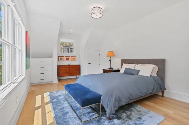 a bedroom with a bed and dresser