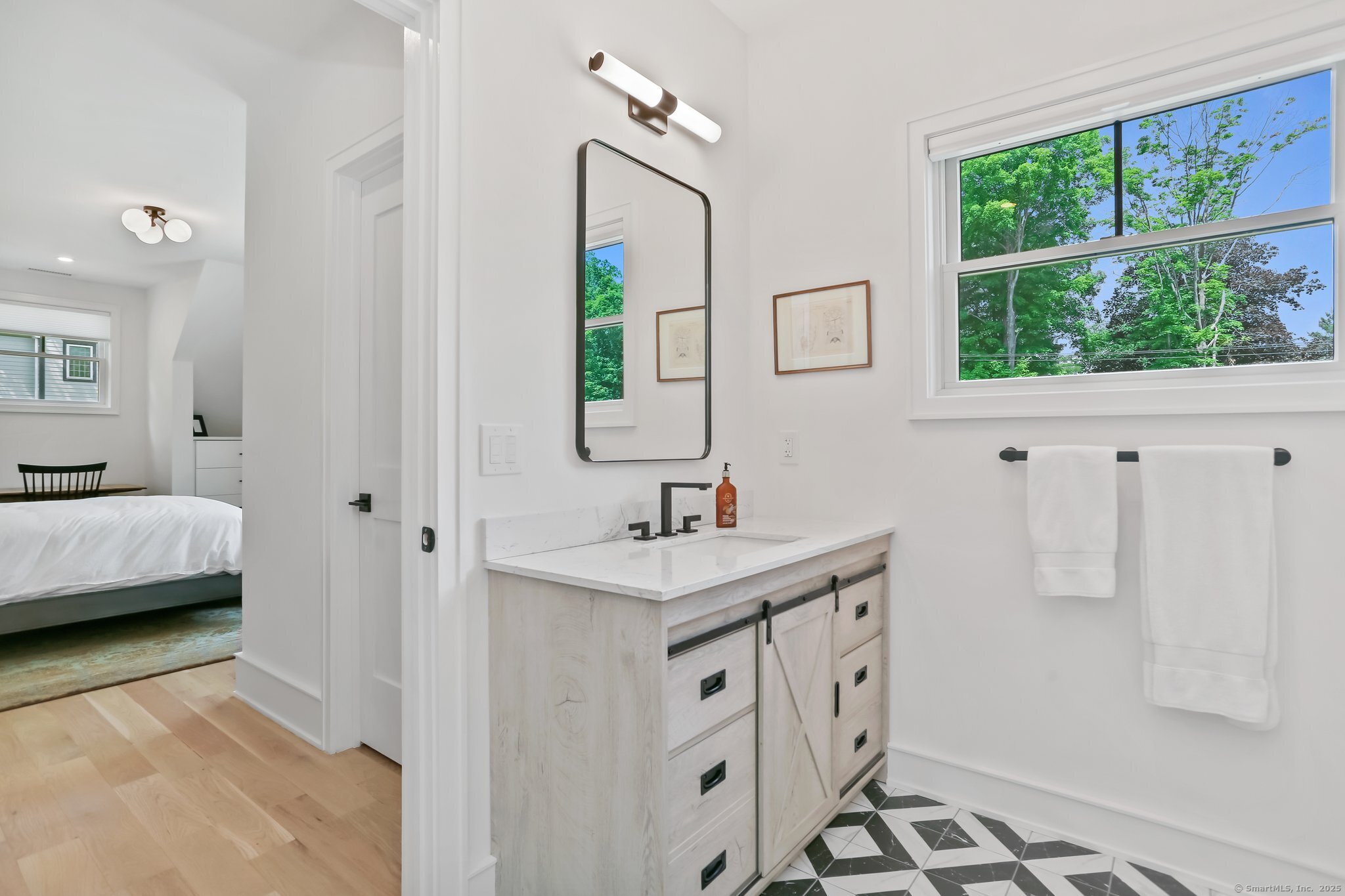 2015 Redding Road Fairfield, CT 06824 - Photo 30 of 40 a bathroom with a sink toilet and window