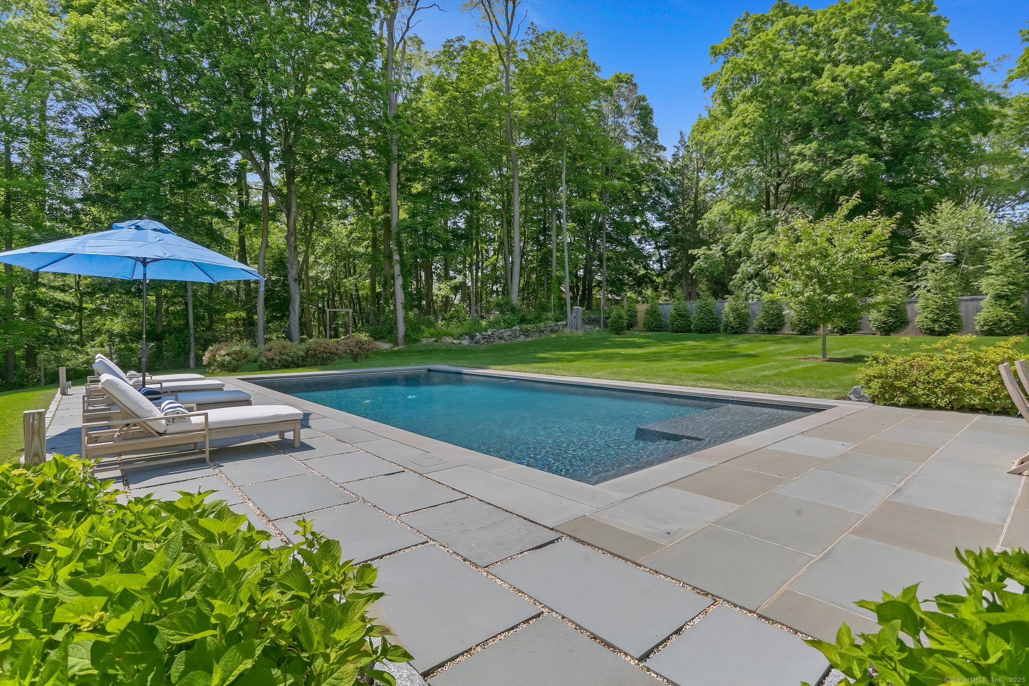2015 Redding Road Fairfield, CT 06824 - Photo 38 of 40 a view of a park with plants and a bench