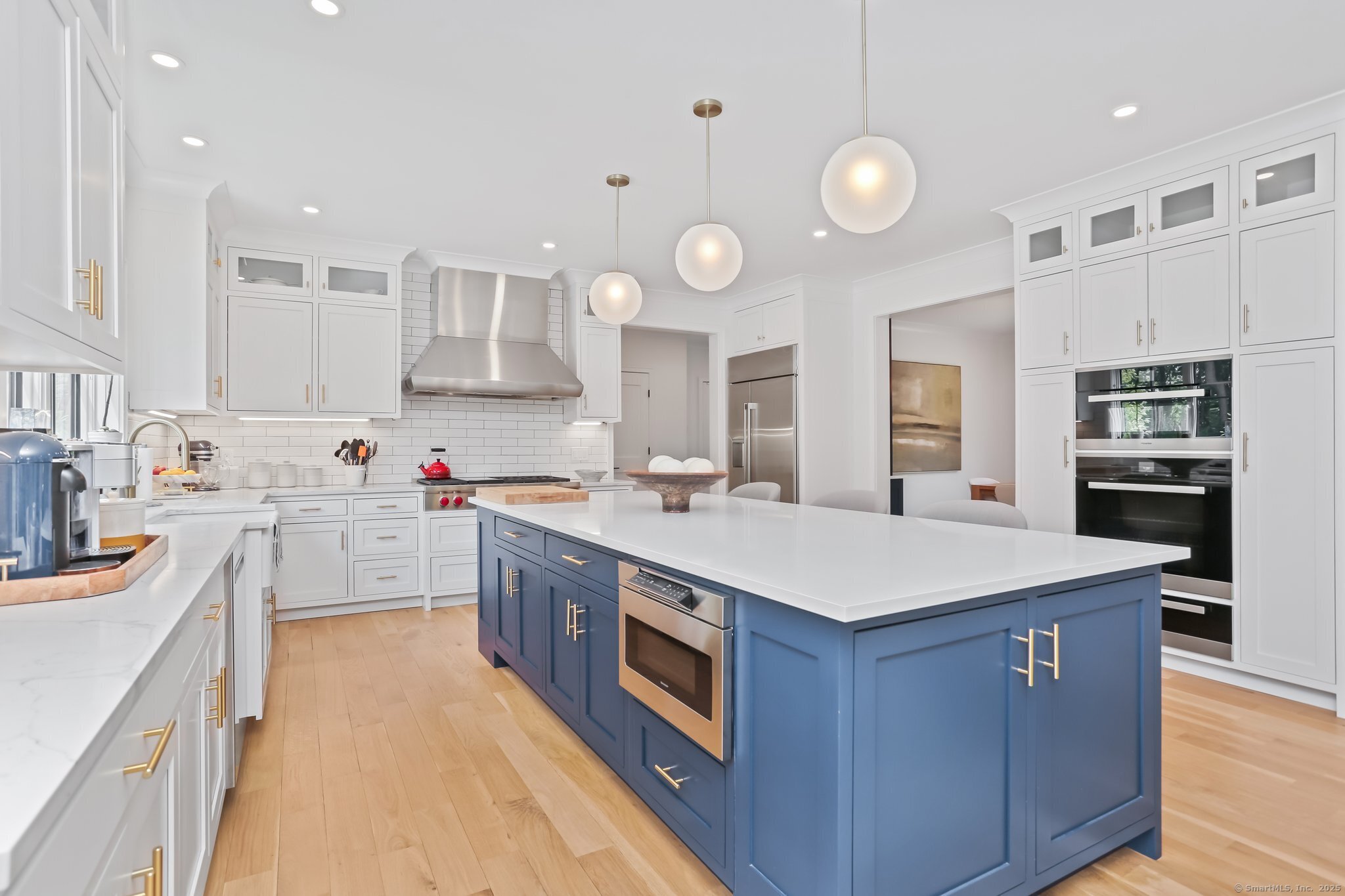 2015 Redding Road Fairfield, CT 06824 - Photo 8 of 40 a kitchen with a stove top oven sink and cabinets