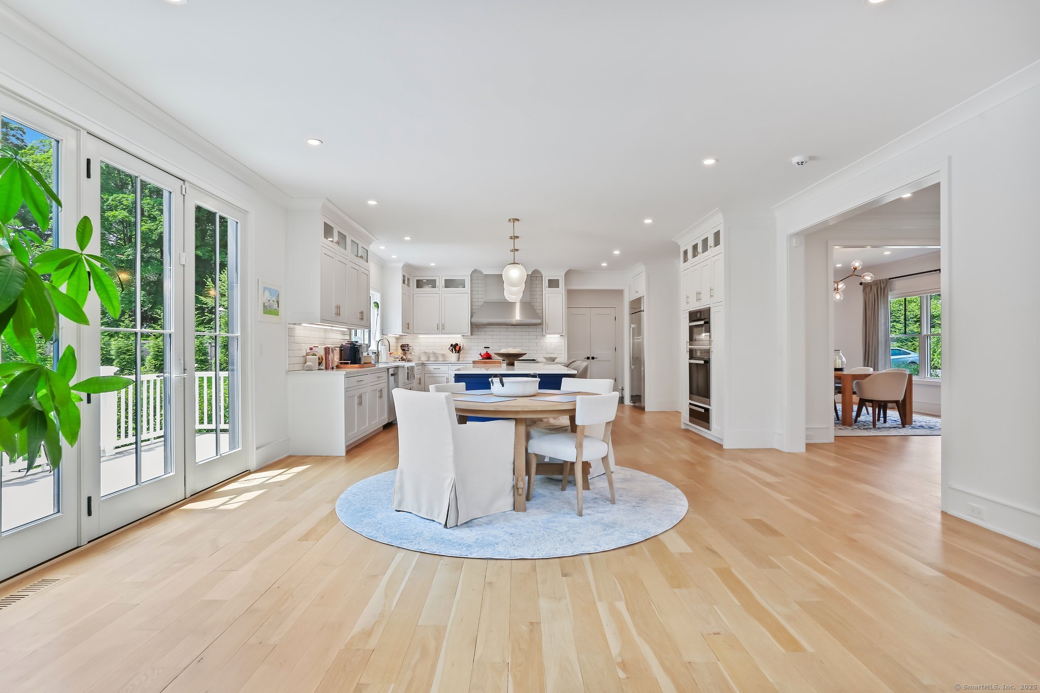 2015 Redding Road Fairfield, CT 06824 - Photo 9 of 40 a kitchen with a table and chairs