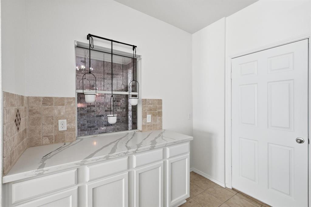 6000 Lost Valley Drive The Colony, TX 75056 - Photo 15 of 40 a bathroom with a granite countertop shower a sink and a mirror
