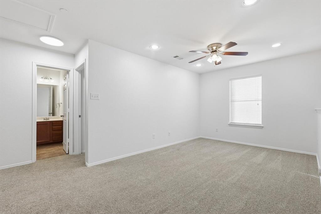 6000 Lost Valley Drive The Colony, TX 75056 - Photo 18 of 40 wooden floor in an empty room with a window