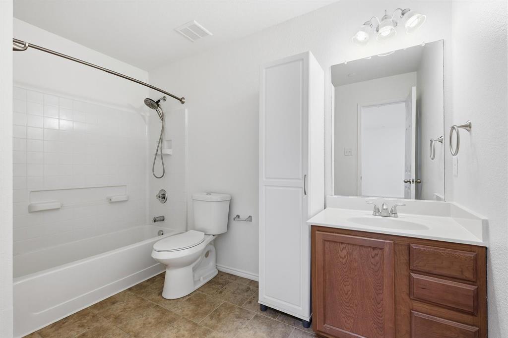 6000 Lost Valley Drive The Colony, TX 75056 - Photo 27 of 40 a bathroom with a sink toilet and shower