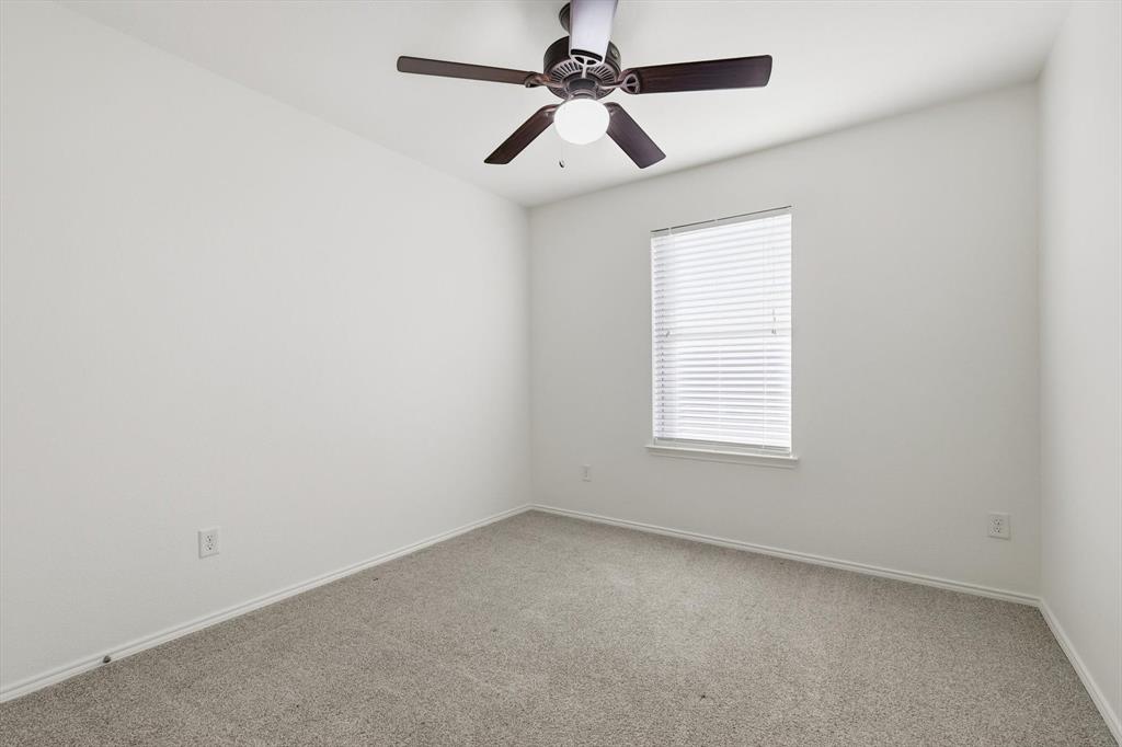 6000 Lost Valley Drive The Colony, TX 75056 - Photo 28 of 40 an empty room with a window and a fan