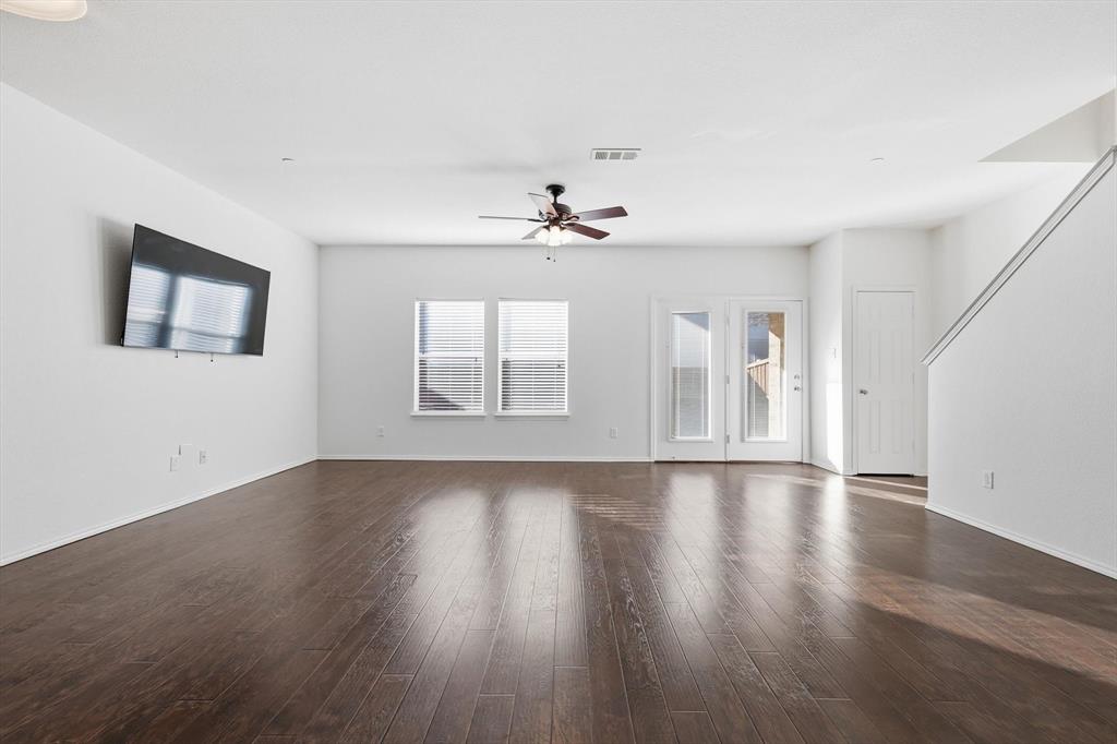 6000 Lost Valley Drive The Colony, TX 75056 - Photo 6 of 40 a view of an empty room with wooden floor and a window