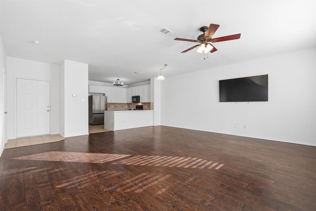 6000 Lost Valley Drive The Colony, TX 75056 - Photo 7 of 40 a view of a kitchen with a sink and a ceiling fan