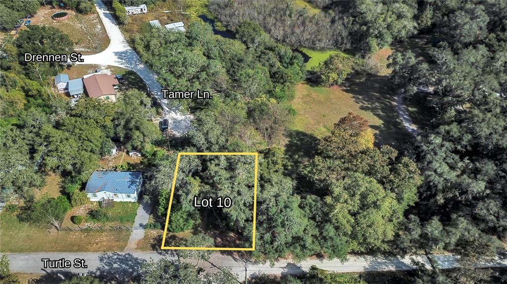 an aerial view of residential house with outdoor space