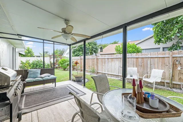 a dining room with furniture water view and garden view