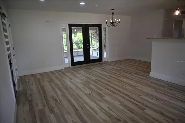 a view of a kitchen with a sink and a large window