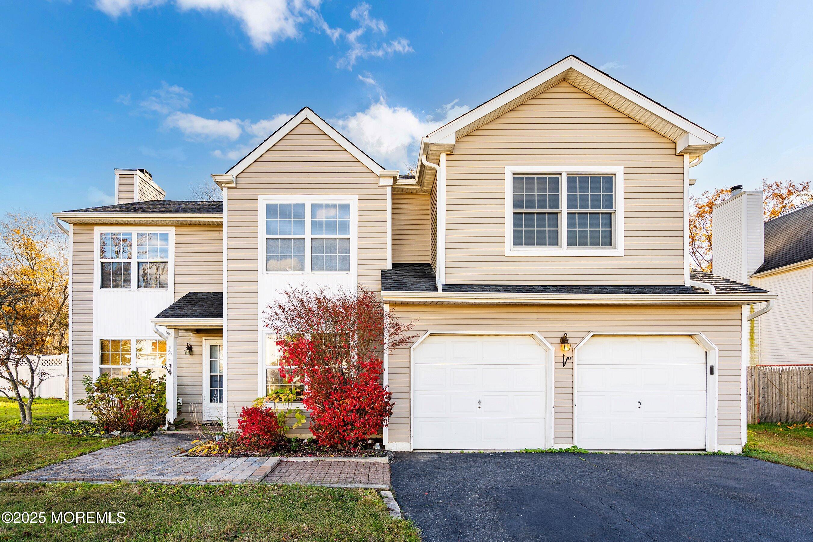 front view of a house with a yard