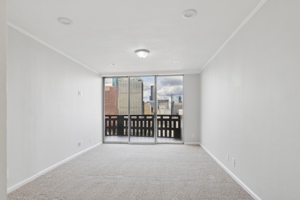 2016 Main Street, Unit 2507 Houston, TX 77002 - Photo 18 of 32 a view of a room with large window