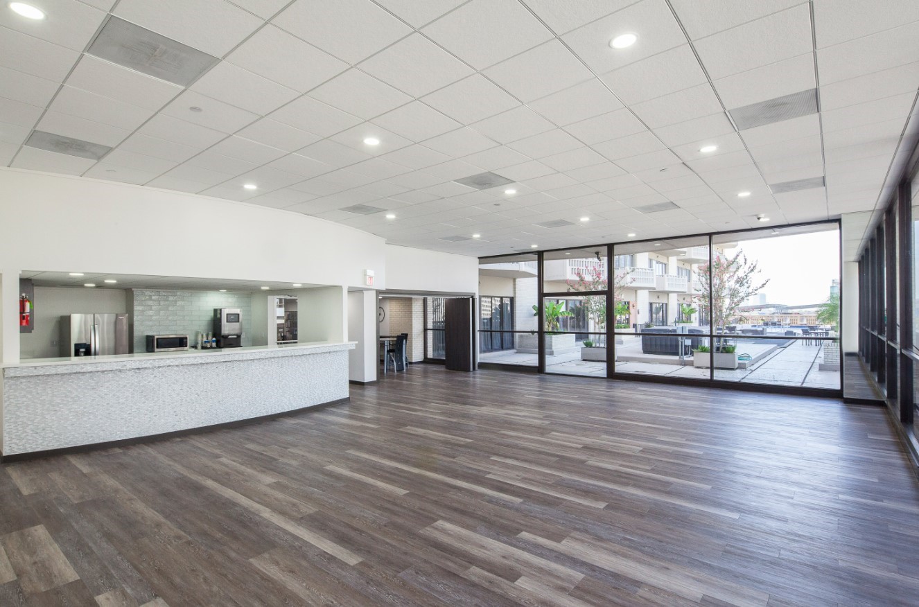2016 Main Street, Unit 2507 Houston, TX 77002 - Photo 25 of 32 a view of a big room with wooden floor and windows